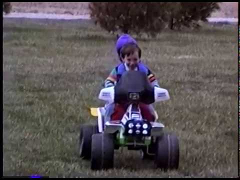 Kelsey & Logan Riding 4 wheeler Around the Yard